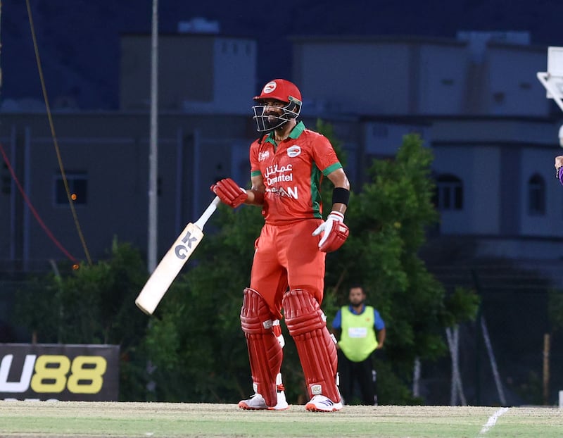 Oman opener Kashyap Prajapati celebrates reaching his half century against the UAE. He made 53 not out off 38 balls.  