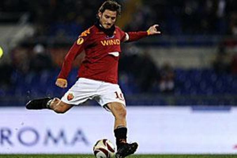 Francesco Totti scores a penalty during his side's Europa League win against Basle on Thursday.