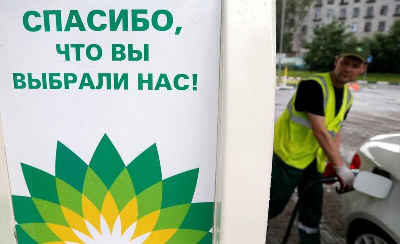 An employee fills the tank of a car at a BP petrol station in Moscow in 2016. Reuters