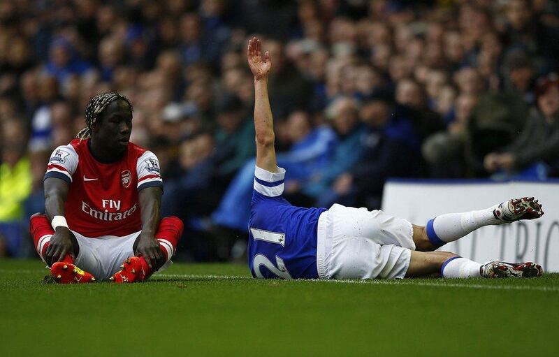 Everton player Leon Osman reacts after a collision with Arsenal player Bacary Sagna during his side's Premier League victory on Sunday. Darren Staples / Reuters / April 6, 2014