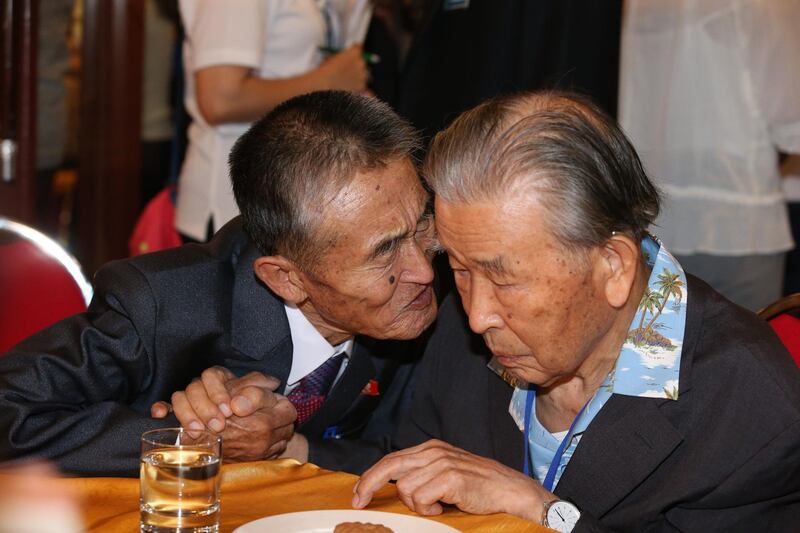 MOUNT KUMGANG, NORTH KOREA - AUGUST 20: (SOUTH KOREA OUT) South Korean Lee Moon-Hyuk (95, R) meets with his North Korean nephew during a separated family reunion meeting at the Mount Kumgang resort on August 20, 2018 in Mount Kumgang, North Korea. Almost a hundred South Koreans crossed the heavily armed border to meet their separated families for the first time since the 1950-53 Korean War, during a family reunion at North Korea. A total of 88 people from North Korea will also receive a chance to meet their families in the South during the six-day event which starts on August 20 at Mount Kumgang, north of the border between North and South Korea. (Photo O Jong-Chan-Korea Pool/Getty Images)