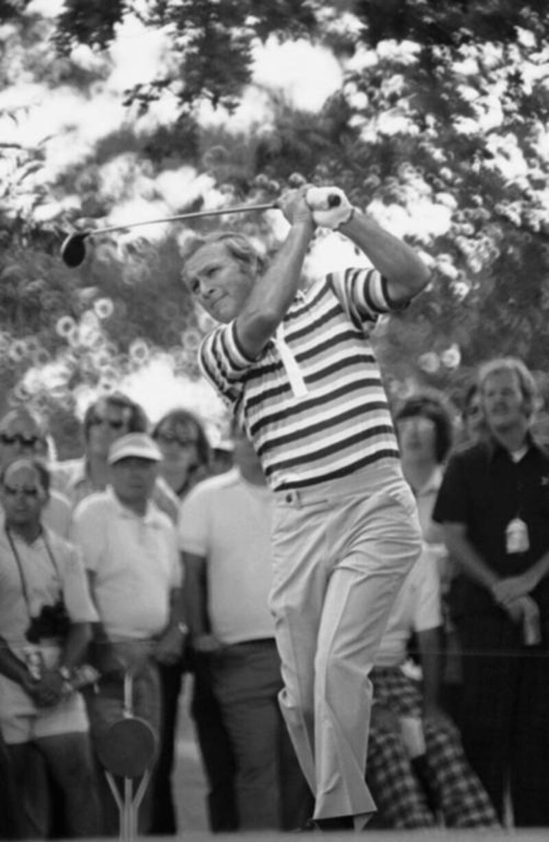 This July 16, 1976, file photo shows Arnold Palmer finishing his follow through as he drove from the 11th tee during the first day of competition in the Westchester Classic at the Westchester Country Club in Harrison, New York. AP Photo