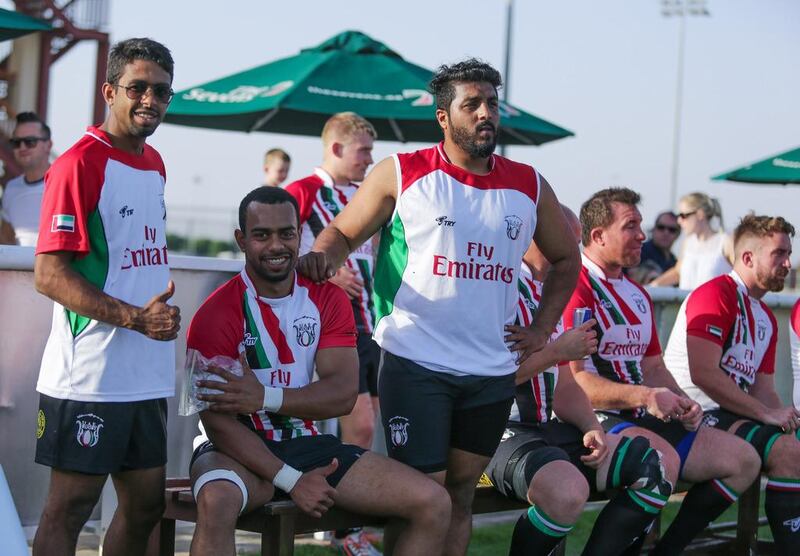 Majid Al Balooshi, second left, on the sidelines during the UAE's recent warm-up match against the Conference Barbarians. Victor Besa for The National
