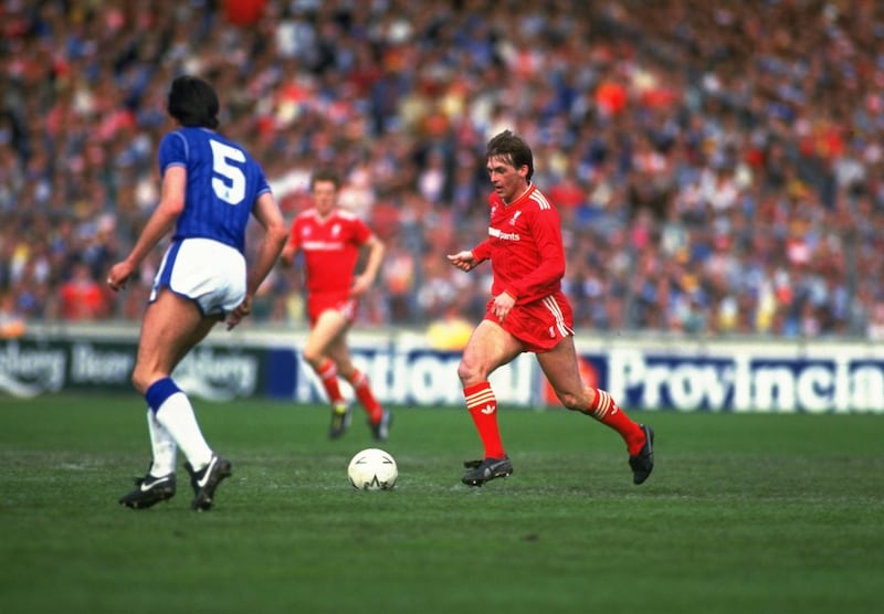 May 1986:  Kenny Dalglish of Liverpool takes on an Everton defender during the FA Cup final at Wembley Stadium in London. Liverpool won the match 3-1. \ Mandatory Credit: Allsport UK /Allsport