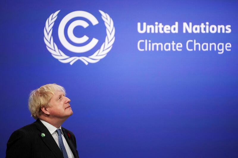 Britain's Prime Minister Boris Johnson looks on as he prepares to receive attendees during the UN Climate Change Conference in Glasgow, Scotland. Reuters