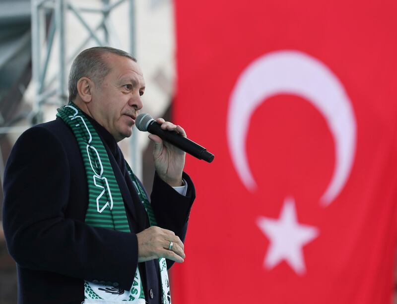 Turkey's President Recep Tayyip Erdogan delivers a speech during a rally in Konya, Turkey, Monday, Dec. 17, 2018. Erdogan said he received "positive answers" from U.S. President Donald Trump on the situation in northern Syria, where Turkey has threatened to launch a new operation against American-backed Syrian Kurdish fighters. The two leaders spoke by phone Friday. (Presidential Press Service via AP, Pool)