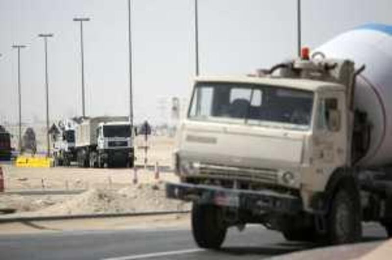 March 10, 2009 / Abu Dhabi/  Large trucks roll along on Street 33 in Khalifa City B  March 10, 2009.  (Sammy Dallal / The National)

 *** Local Caption ***  sd-031009-street33-01.jpg