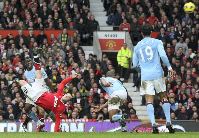MANCHESTER, ENGLAND - FEBRUARY 12:  Wayne Rooney of Manchester United scores their second goal during the Barclays Premier League match between Manchester United and Manchester City at Old Trafford on February 12, 2011 in Manchester, England.  (Photo by Matthew Peters/Man Utd via Getty Images)