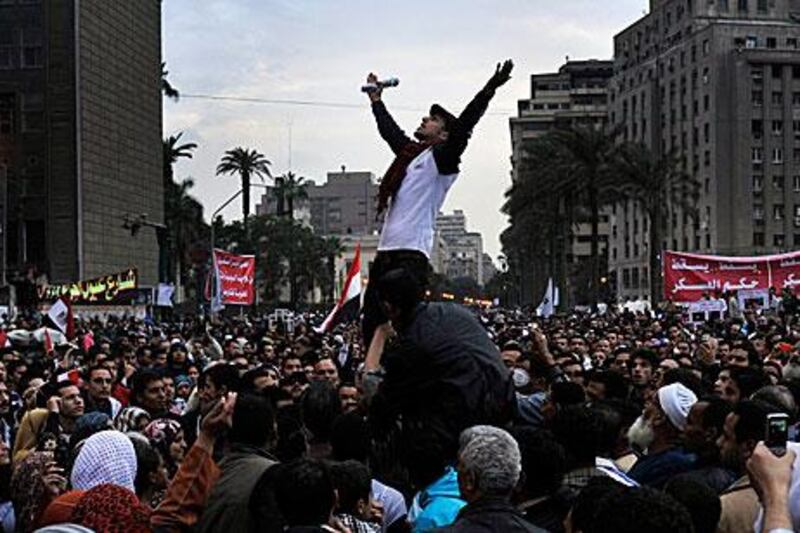 Egyptians protest against the ruling military council in Tahrir Square in Cairo yesterday. Egypt’s military ruler warned of “extremely grave” consequences if the nation does not pull through its current crisis and urged voters to turn out for the parliamentary elections starting today.
