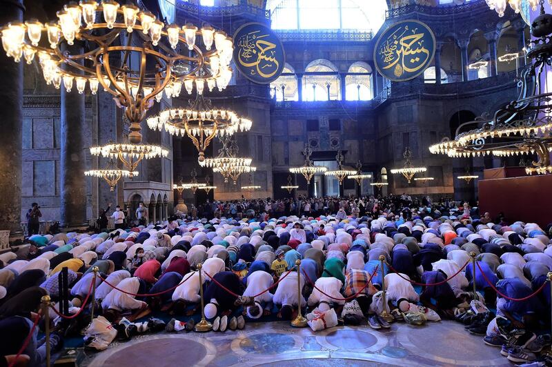 People pray inside the Byzantine-era Hagia Sophia, during afternoon prayers, in the historic Sultanahmet district of Istanbul.  AP