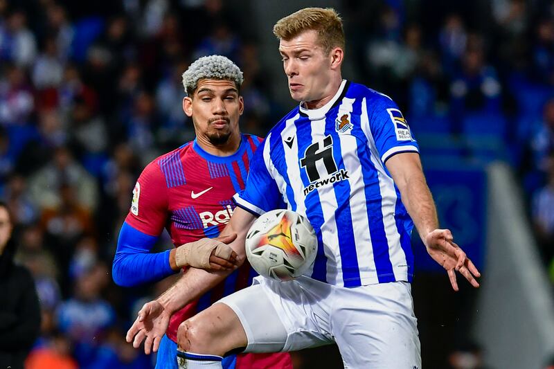 Real Sociedad's Alexander Sorloth, right, vies for the ball with Barcelona's Ronald Araujo. AP Photo