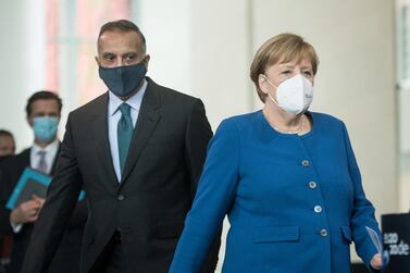 German Chancellor Angela Merkel and Iraqi Prime Minister Mustafa Al Kadhimi arrive for a press conference at the Chancellery in Berlin, Germany, on October 20, 2020. Reuters