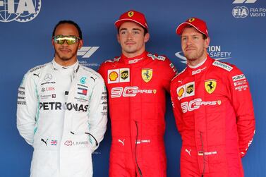 Lewis Hamilton of Mercedes, left, first-placed Charles Leclerc of Ferrari and third-placed Sebastian Vettel after qualifying at the Sochi Autodrom circuit. EPA