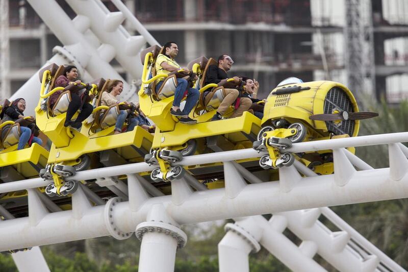 Visitors ride the Flying Aces roller coaster at Ferrari World in Abu Dhabi. Christopher Pike / The National