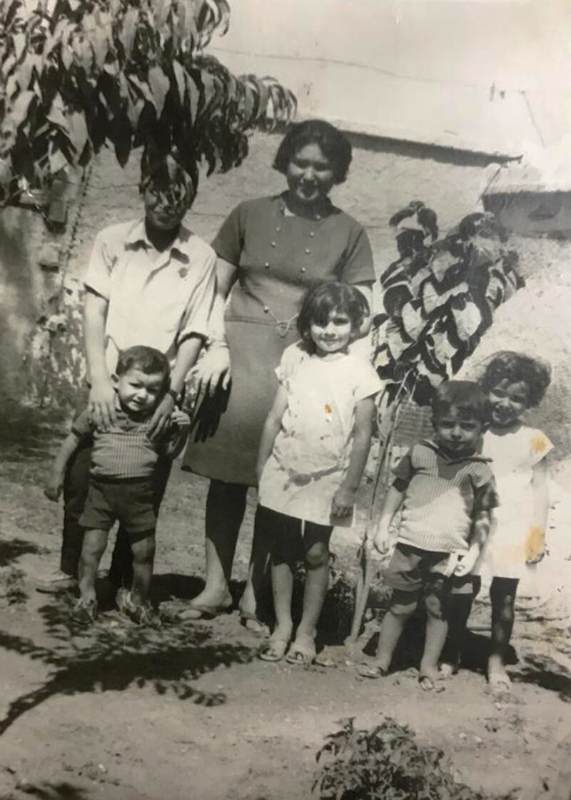 Majida Obaid, in the centre dressed in white, with her mother and siblings when they lived in the British camp in Sharjah in 1972. All photos: Majida Obaid
