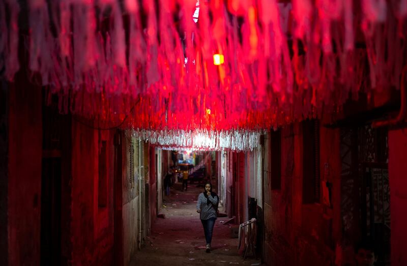 A girl walks underneath Ramadan decoration in Cairo. EPA