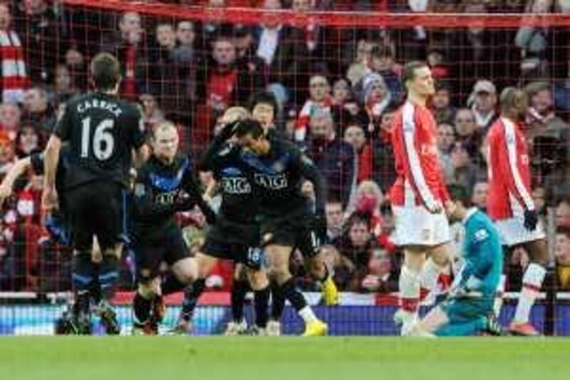 Manchester United's Nani, center, celebrates his goal against Arsenal with teammates during their English Premier League soccer match at the Emirates Stadium, London, Sunday, Jan 31, 2010. (AP Photo/Tom Hevezi) ** NO INTERNET/MOBILE USAGE WITHOUT FOOTBALL ASSOCIATION PREMIER LEAGUE (FAPL) LICENCE - CALL +44 (0)20 7864 9121 or EMAIL info@football-dataco.com FOR DETAILS ** *** Local Caption ***  LST111_BRITAIN_SOCCER_PREMIER_LEAGUE.jpg