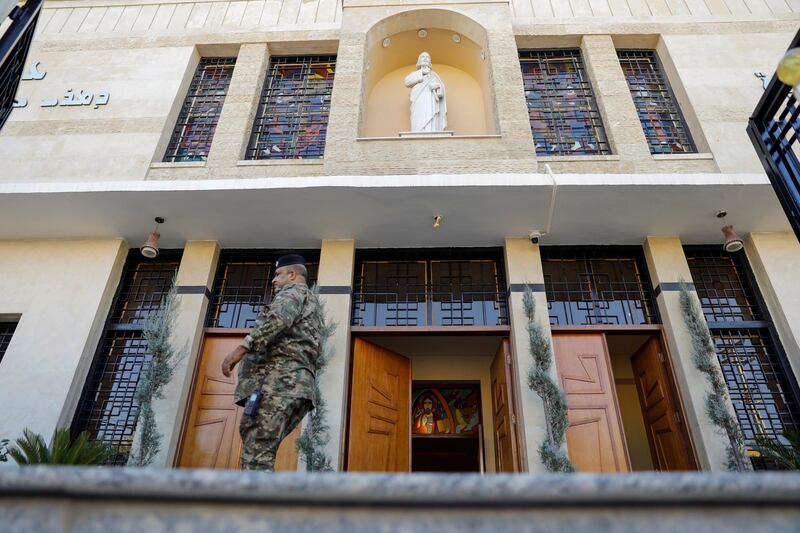 A soldier passes the entrance of St Joseph Chaldean Cathedral, where Pope Francis will hold Mass. Reuters