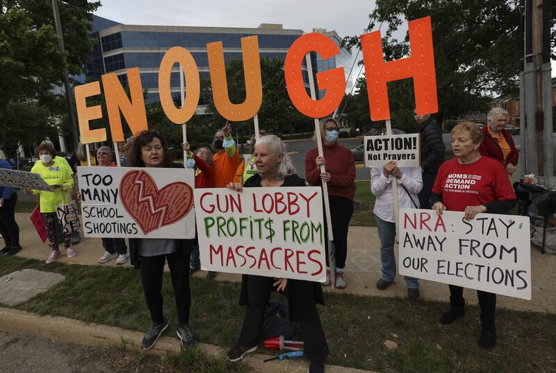 Gun-control advocates hold a vigil outside of the National Rifle Association (NRA) headquarters following the recent mass shooting at Robb Elementary School on May 25, in Uvalde, Texas. Getty / AFP
