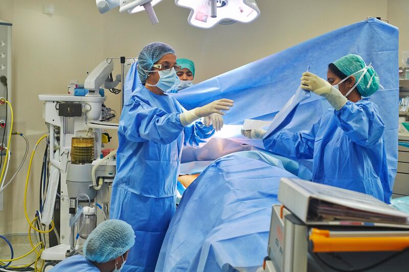 DUBAI, UNITED ARAB EMIRATES,  JUNE 17, 2013. Working moms. Dr. Houriya Kazim BSc, MPH, MB BCh, FRCS, Medical Director and Specialist Breast Surgeon, an Emirati and the country's first female surgeon at work on a surgery at the Dubai London Speciailty Hosptial on Beach rd.  Freelancer is Rachel Lewis. (ANTONIE ROBERTSON / The National)