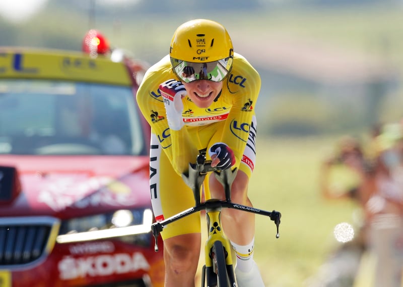 UAE Team Emirates rider Tadej Pogacar celebrates as he finishes the time trial on Stage 20 of the Tour de France on Saturday, July 17.