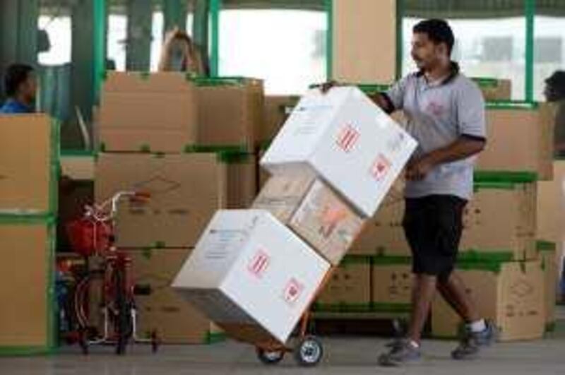 Dubai - June 18, 2009 - Boxes are stacked on the loading dock after being x-rayed by customs agents at Jebel Ali Port in Dubai, June 18, 2009. (Photo Jeff Topping/The National) *** Local Caption ***  JT007-0618-PORT SECURITY 7F8Q5500.jpg