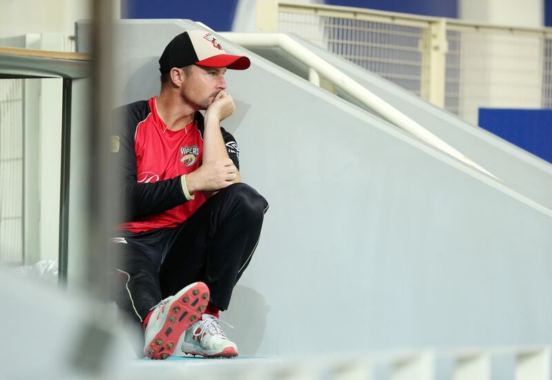 Vipers captain Colin Munro watches from the dugout.