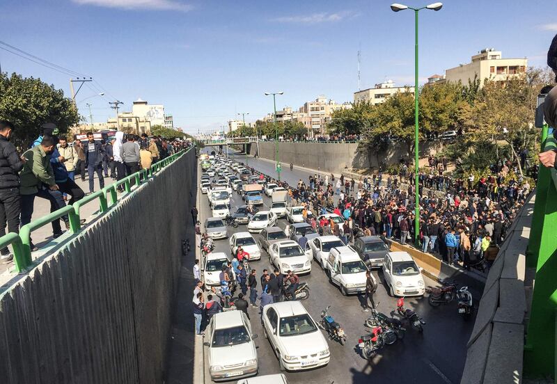 Iranian protesters block a road in the central city of Isfahan.  AFP