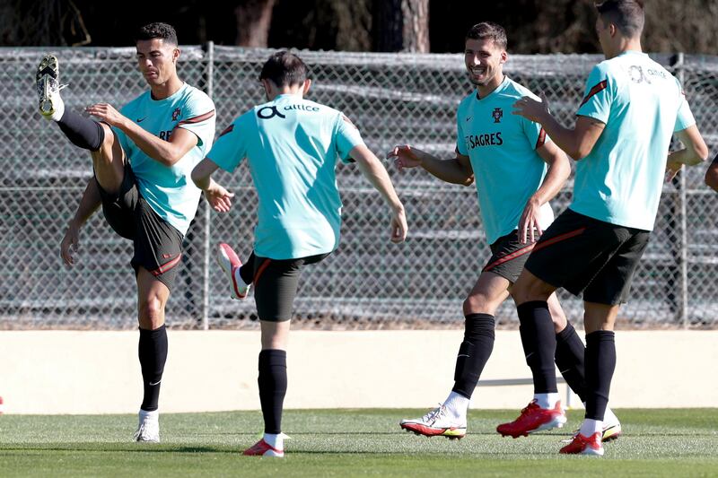 From left, Cristiano Ronaldo, Bernardo Silva, Ruben Dias and Joao Palhinha during Portugal's training session in Almancil. EPA