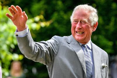 GLOUCESTER, ENGLAND - JUNE 16: Prince Charles, Prince of Wales gestures to crowds of hospital staff watching from a distance as he chats with front line key workers who who have responded to the COVID-19 pandemic during a visit to Gloucestershire Royal Hospital on June 16, 2020 in Gloucester, England. (Photo by WPA Pool-Ben Birchall/Getty Images)