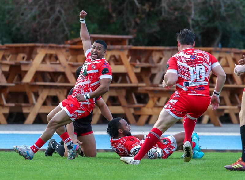 Imad Reyal celebrates after Saki Naisau scores a try for Dubai Tigers.