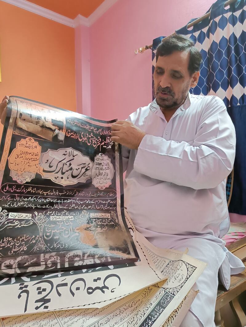 Mr Ghalib displays a poster he worked on. Other jobs regularly given to calligraphers in the past included writing script for newspapers, magazines and books. 