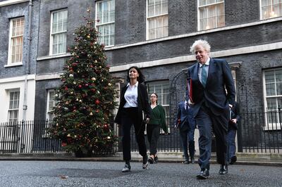 Britain's Prime Minister Boris Johnson with Munira Mirza in London. Ms Mirza quit after Mr Johnson made a widely debunked claim as he attacked the opposition leader. AFP