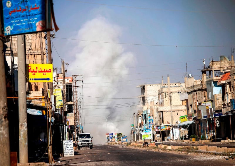 EDITORS NOTE: Graphic content / A picture taken on June 21, 2018 shows smoke plumes rising from regime bombardment in Al-Hirak in the eastern Daraa province countryside in southern Syria. Thousands of civilians have fled "intensified" regime bombardments of rebel-held areas in the southern Syrian province of Daraa in the past three days as fears mount of a full-blown assault, with the government amassing troops there in recent weeks. / AFP / Mohamad ABAZEED
