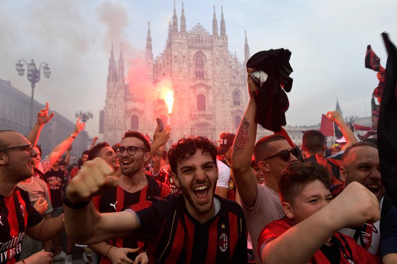 AC Milan fans celebrate after winning the Serie A title. Reuters
