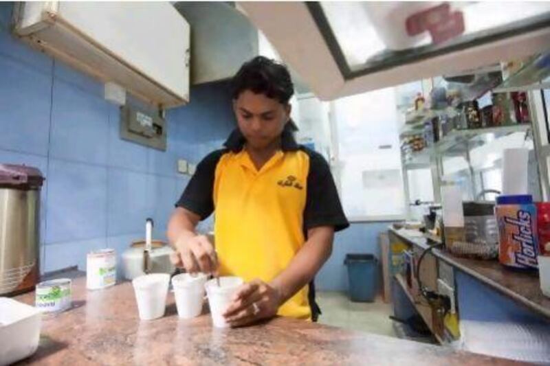Zayed Thottungal, 20, from Kerela working at Malik Al Karak Cafeteria early in the morning.