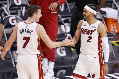 MIAMI, FLORIDA - DECEMBER 30: Goran Dragic #7 of the Miami Heat celebrates with Gabe Vincent #2 after defeating the Milwaukee Bucks 119-108 at American Airlines Arena on December 30, 2020 in Miami, Florida. NOTE TO USER: User expressly acknowledges and agrees that, by downloading and or using this photograph, User is consenting to the terms and conditions of the Getty Images License Agreement.   Michael Reaves/Getty Images/AFP
== FOR NEWSPAPERS, INTERNET, TELCOS & TELEVISION USE ONLY ==
