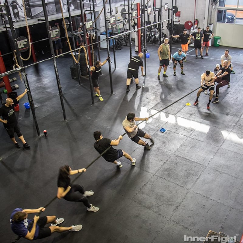 Unlike most other workouts, CrossFit allows participants to work out in tandem with one another, creating a community feel. Photo: Inner Fight 