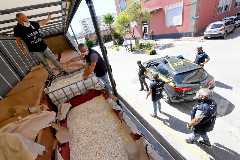 MMembers of the Naples branch of the Italian Guardia di Finanza (GdF) law enforcement agency inspect a world record seizure of a 14-tonne haul of amphetamines.  EPA