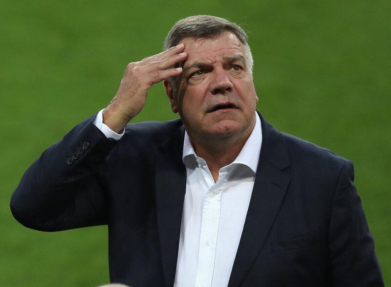 England manager Sam Allardyce rubs his forehead as he inspects the pitch prior to the 2018 World Cup Qualifying Group F match against Slovakia at City Arena on September 3, 2016 in Trnava, Slovakia. Christopher Lee / Getty Images