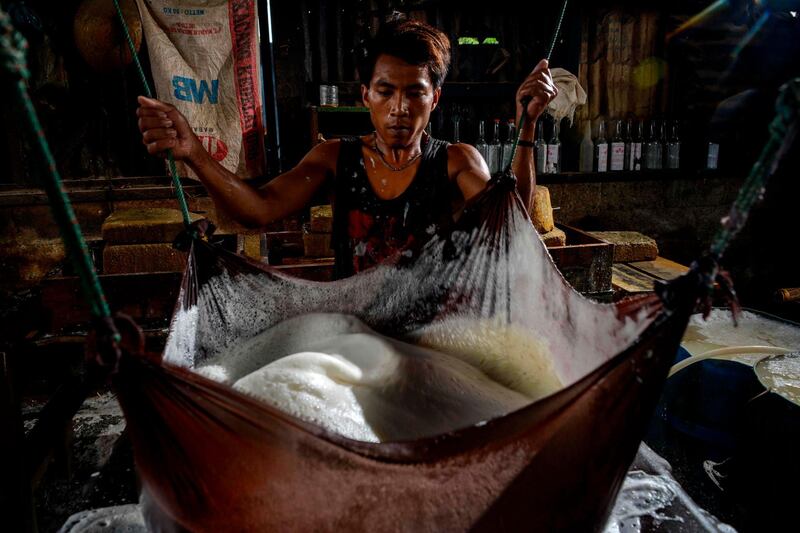 A worker makes tofu from soybeans at a facility in Banda Aceh, Indonesia, on October 12. Chaideer Mahyuddin / AFP