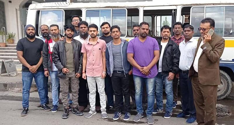 Indian sailors held in Yemen for 10 months before they were released on November 28. The 14 men transited through Dubai on their return to India on Sunday. Courtesy: Pravasi Legal Cell