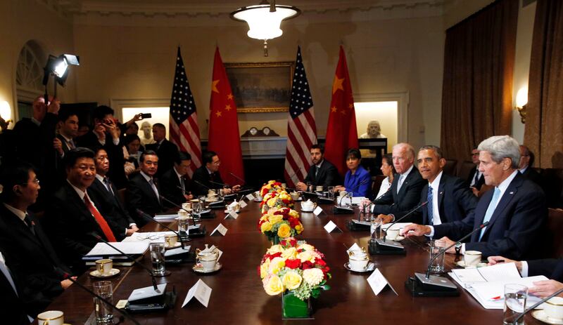 In 2015, US president at the time Barack Obama (2R), Mr Xi (2L) and their delegations meet at the White House, with then vice president Joe Biden (3R) and Secretary of State John Kerry also participating. Reuters