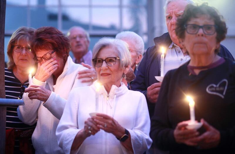 Mourners participate in a candle light vigil for the victims of the Chabad of Poway Synagogue shooting at the Rancho Bernardo Community Presbyterian Church on April 27, 2019 in Poway, California. AFP