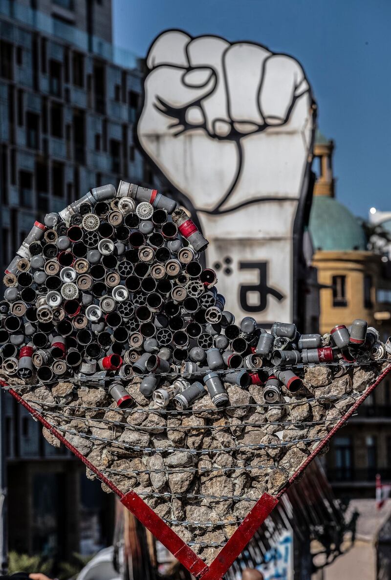 A memorial of a broken heart made of gas tear bombs and stones which were used during clashes between protesters and riot police during the past weeks, has been placed next to the fist symbol of the revolution in the Martyrs' Square in Beirut, Lebanon.  EPA