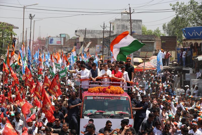 Indian National Congress party president Rahul Gandhi (L) and his sister Priyanka Gandhi (R) wave during a roadshow before filing his nomination for the upcoming general election at the district collector's office in Amethi on April 10, 2019.
PHOTO : JITENDRA PRAKASH