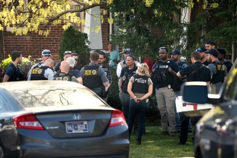 Metro Nashville Police and federal law enforcement agents search the home of the shooter. The Tennessean / AP