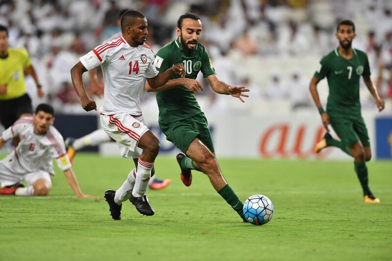 UAE defender Mahmoud Khamis, left, vies for the ball with Saudi Arabia forward Mohammed Al Sahlawi at Hazza bin Zayed Stadium on Tuesday. Giuseppe Cacace / AFP