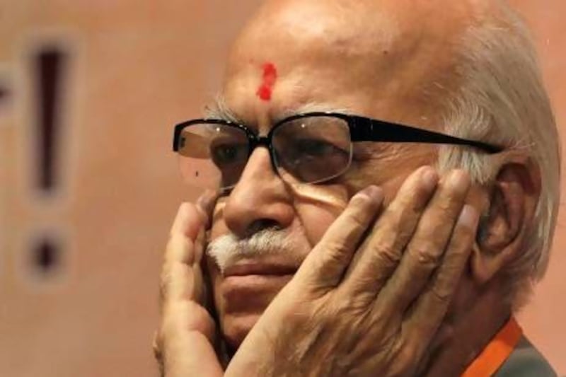 FILE ñ In this May 24, 2012 file photo, Indiaís opposition Bharatiya Janata Party (BJP) senior leader Lal Krishna Advani gestures during the party's national executive meeting in Mumbai, India. Advani, a founding member of the rightwing BJP resigned from all party positions on June, 10, 2013, a day after the party appointed a controversial Hindu ideologue to lead its campaign in national elections next year. (AP Photo/ Rajanish Kakade, File) *** Local Caption *** India Politics.JPEG-03511.jpg