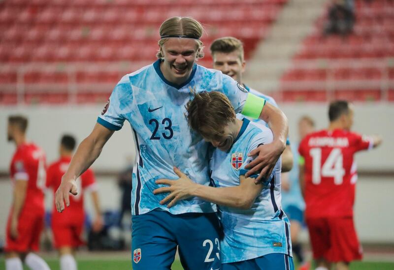 Jonas Svensson celebrates with Erling Braut Haaland after scoring Norway's final goal in their 3-0 World Cup qualifying win against Gibraltor on March 24. Reuters